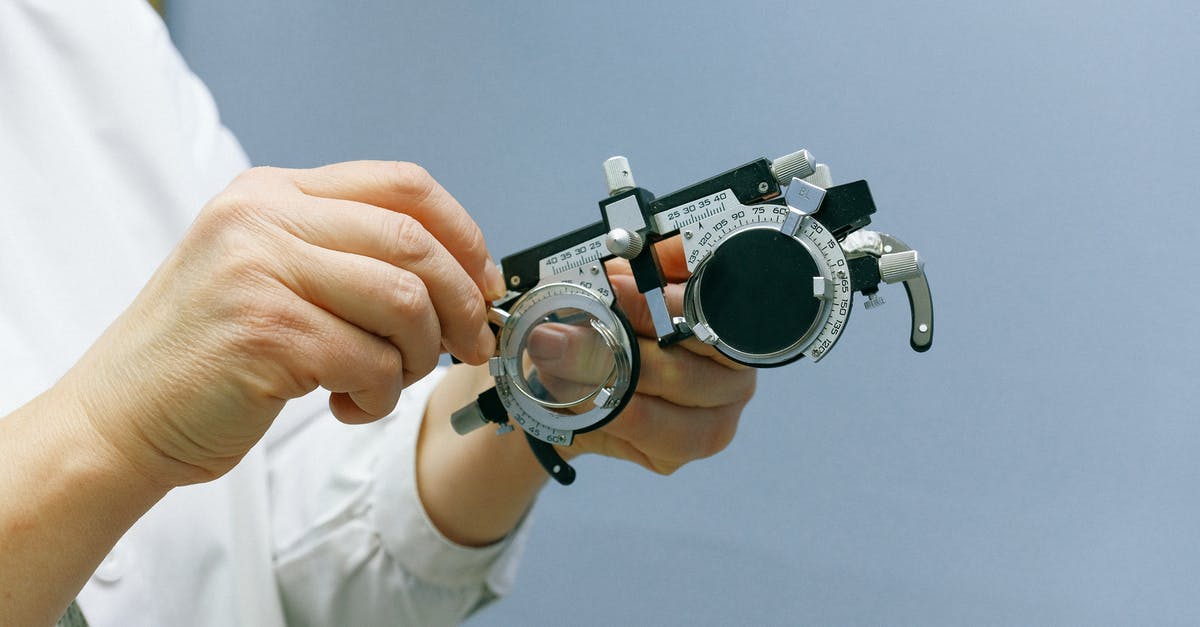 Where can I take a COVID-19 antigenic test in Paris? - Crop anonymous medic showing ophthalmic device Where can I take a COVID-19 antigenic test in Paris? - Crop anonymous medic showing ophthalmic device