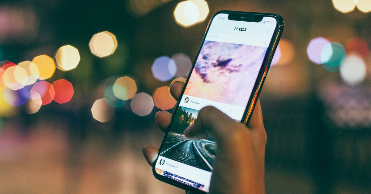 Where can I take the photos of Warsaw Skyline at night? - Bokeh Photography of Person Holding Turned-on Iphone Where can I take the photos of Warsaw Skyline at night? - Bokeh Photography of Person Holding Turned-on Iphone