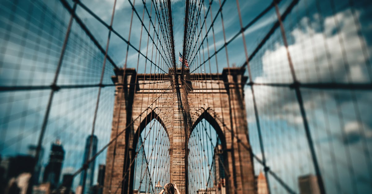 Where can I take the photos of Warsaw Skyline at night? - Blur Photo of Brooklyn Bridge at Daytime Where can I take the photos of Warsaw Skyline at night? - Blur Photo of Brooklyn Bridge at Daytime