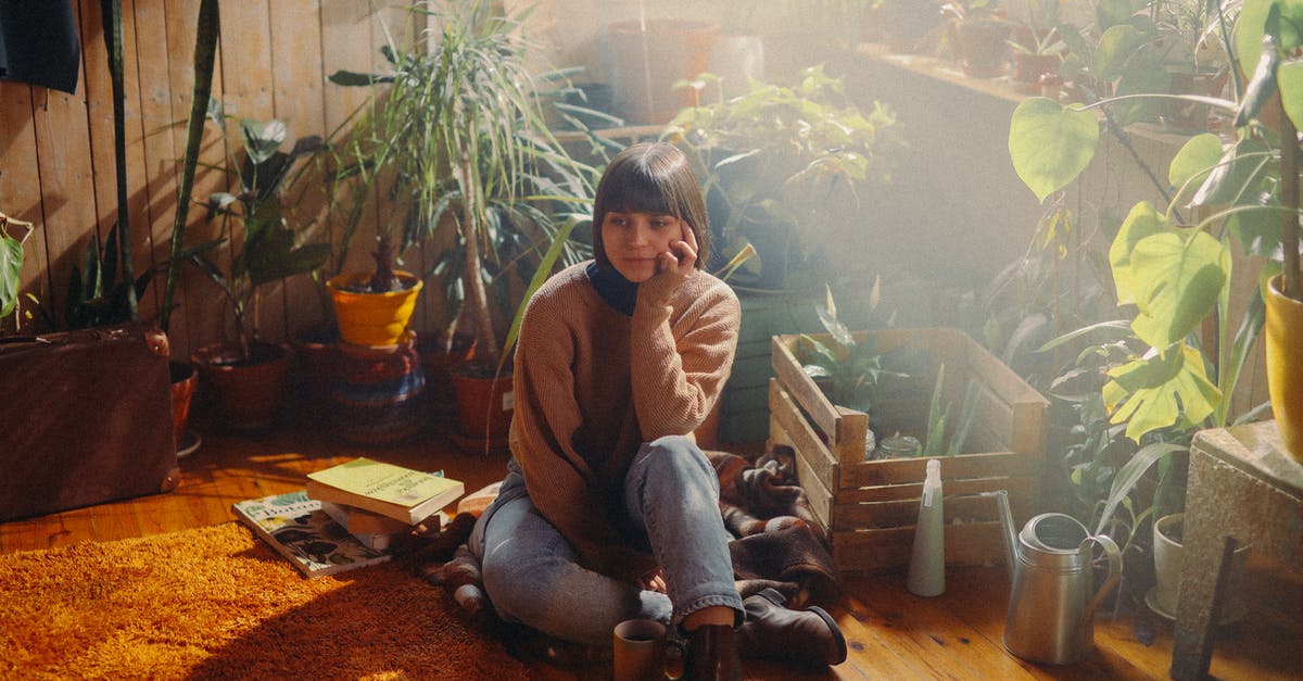 Where can one rent rain boots in Uyuni? - A Woman Sitting on the Floor Near a Wooden Crate With Potted Plants Where can one rent rain boots in Uyuni? - A Woman Sitting on the Floor Near a Wooden Crate With Potted Plants