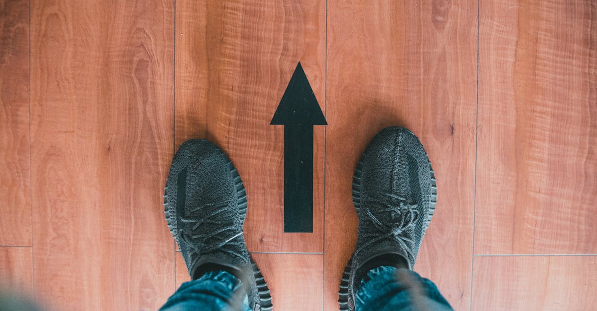 Where do I drop off and pick up a foot passenger in Calais (P&O)? - Photo of Person's Feet Near a Black Arrow Where do I drop off and pick up a foot passenger in Calais (P&O)? - Photo of Person's Feet Near a Black Arrow
