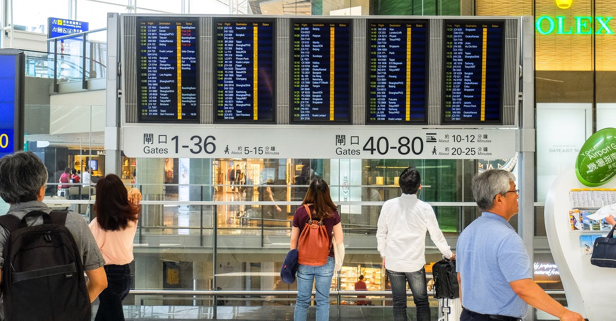 where do i have to pay my extra weight of luggage from Hong Kong to Viet Nam - Airport Departure Board at Hong Kong Airport