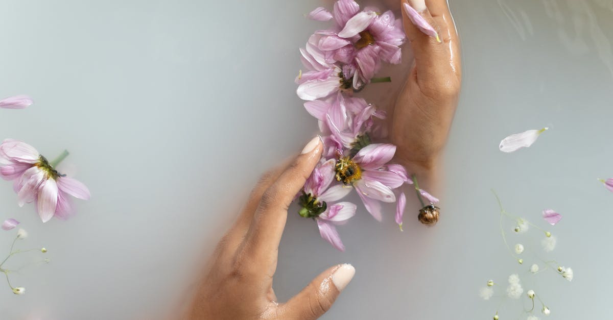 Where exactly does the Carnaval de Barranquilla take place? - Woman holding flowers in hands in water Where exactly does the Carnaval de Barranquilla take place? - Woman holding flowers in hands in water