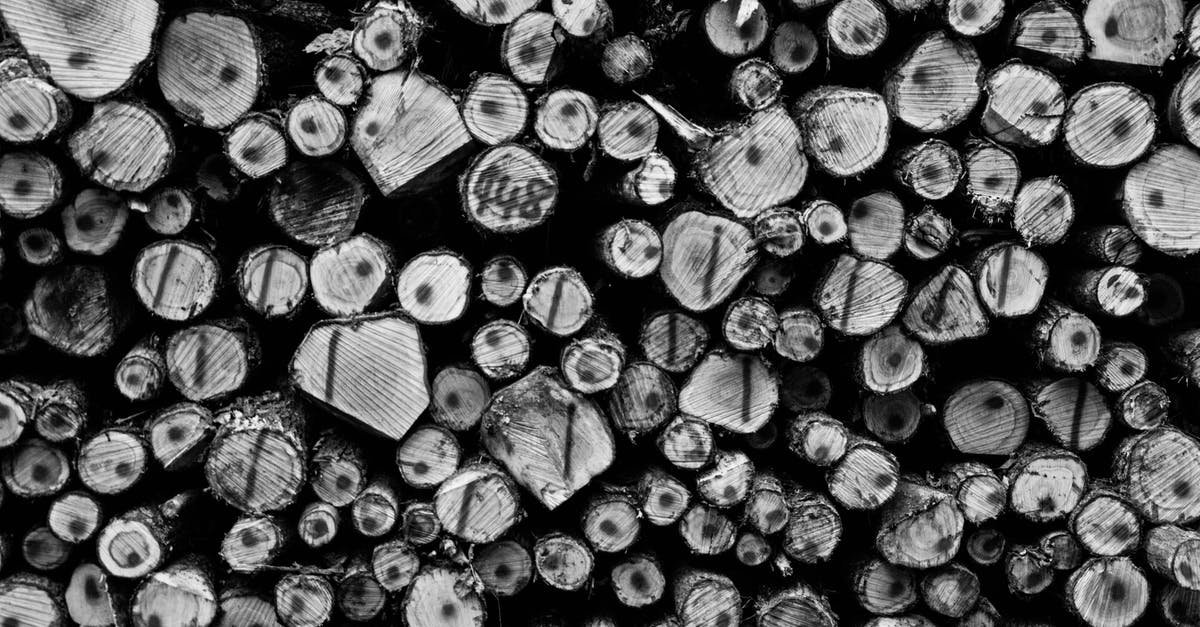 Where in the world am I most likely to see stacked lenticular clouds? - Grayscale Photography of Wirewood Logs