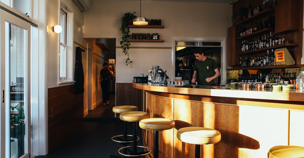Where is the actual entrance to Zagreb airport (Zračna luka Franjo Tuđman)? - Woman in Black Jacket Standing Near Kitchen Counter Where is the actual entrance to Zagreb airport (Zračna luka Franjo Tuđman)? - Woman in Black Jacket Standing Near Kitchen Counter