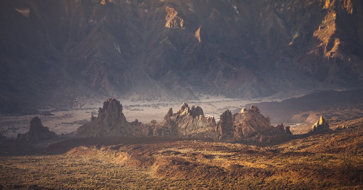 Where is the closest to western Europe to see desert mountains with slot canyons? - Brown and Black Rock Formation Where is the closest to western Europe to see desert mountains with slot canyons? - Brown and Black Rock Formation