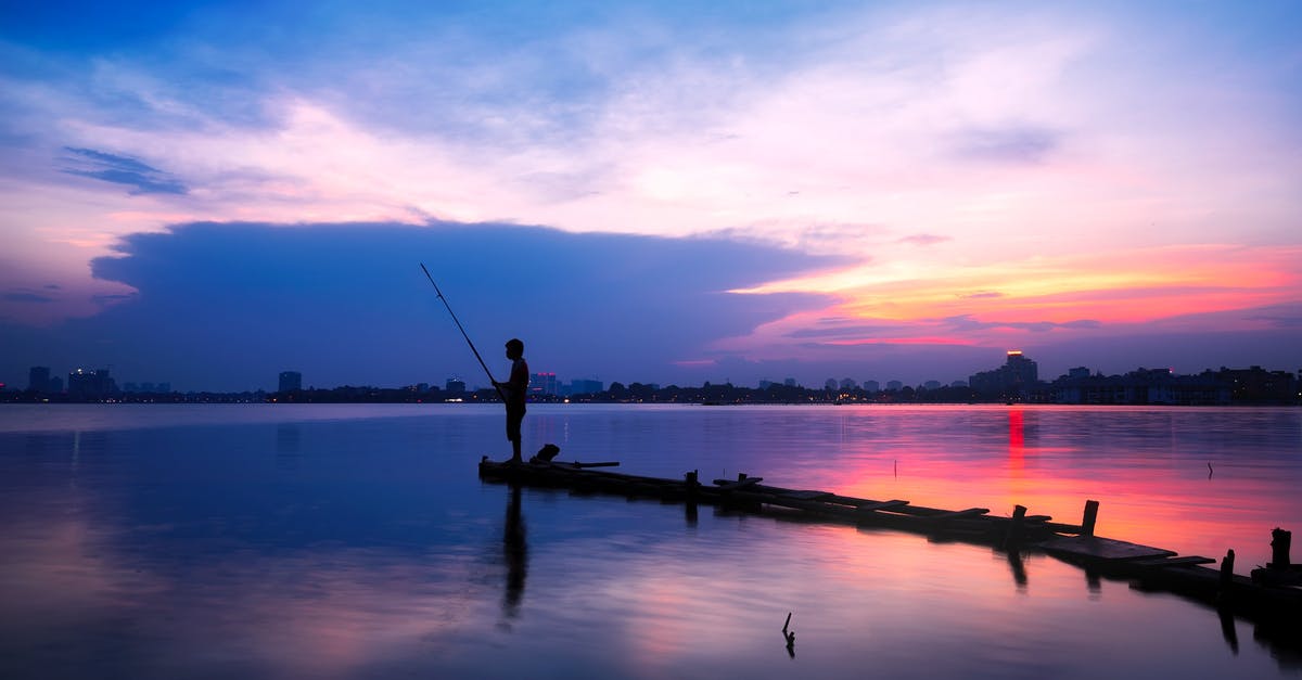 Where is the jetty where you take the boat to visit the Embera communities? - Silhouette of Man Holding Fishing Rod on Body of Water Where is the jetty where you take the boat to visit the Embera communities? - Silhouette of Man Holding Fishing Rod on Body of Water