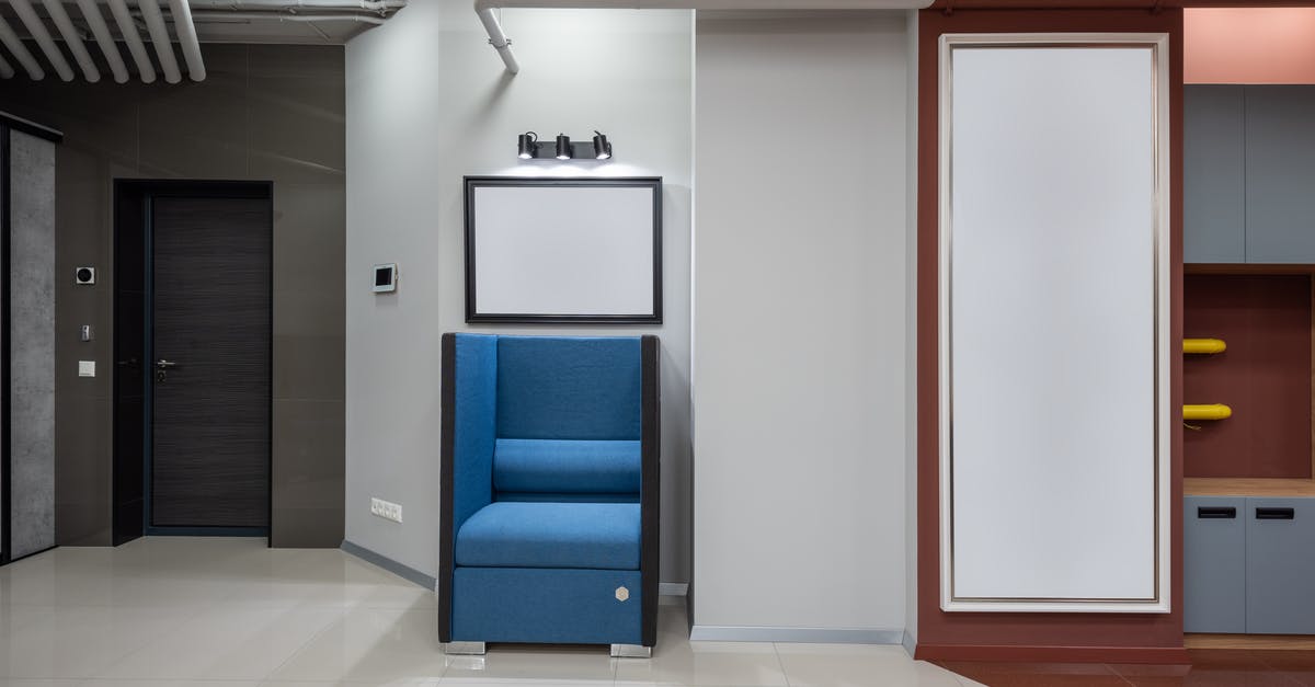 Where is this blue tile in the New York subway? - Lobby of modern office with armchair Where is this blue tile in the New York subway? - Lobby of modern office with armchair