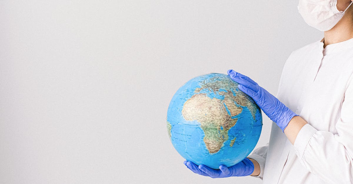 Where is this building on a mountain in Planet Earth 2? - Person With a Face Mask and Latex Gloves Holding a Globe Where is this building on a mountain in Planet Earth 2? - Person With a Face Mask and Latex Gloves Holding a Globe