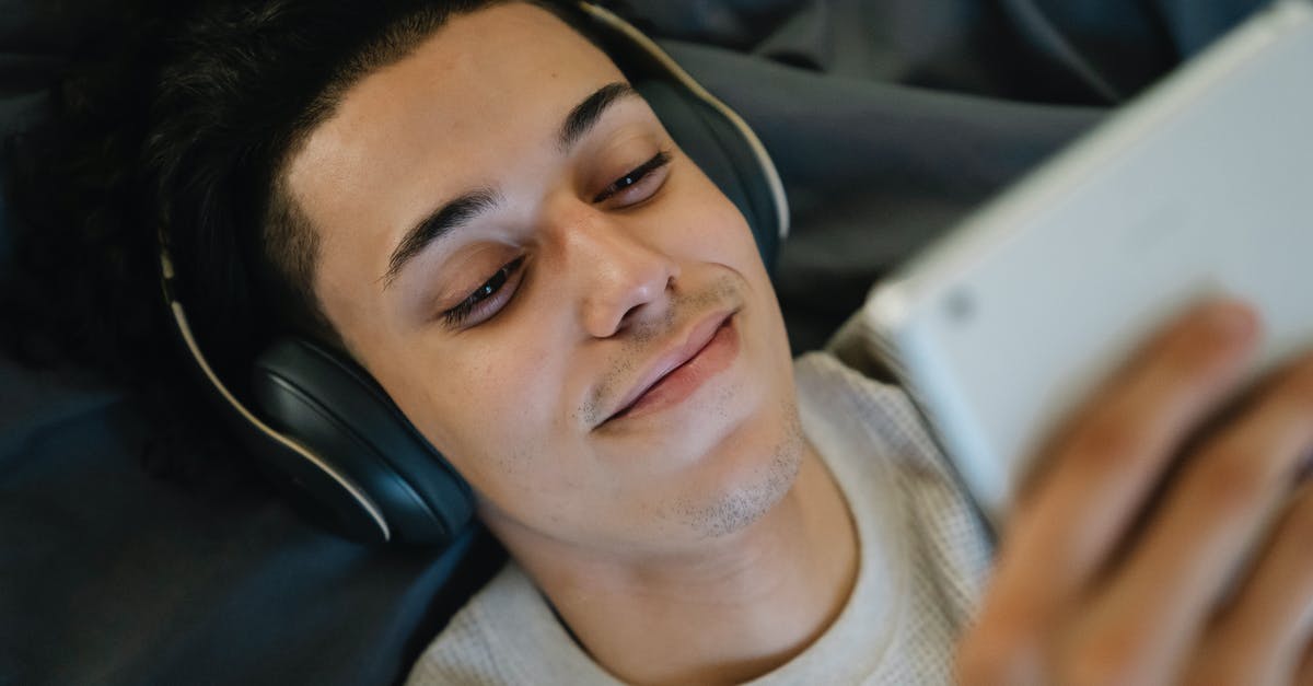 Where is this location from the "A 1000 Times" music video? - Positive young Hispanic man in headphones smiling and watching film on tablet while relaxing on bed at home Where is this location from the "A 1000 Times" music video? - Positive young Hispanic man in headphones smiling and watching film on tablet while relaxing on bed at home