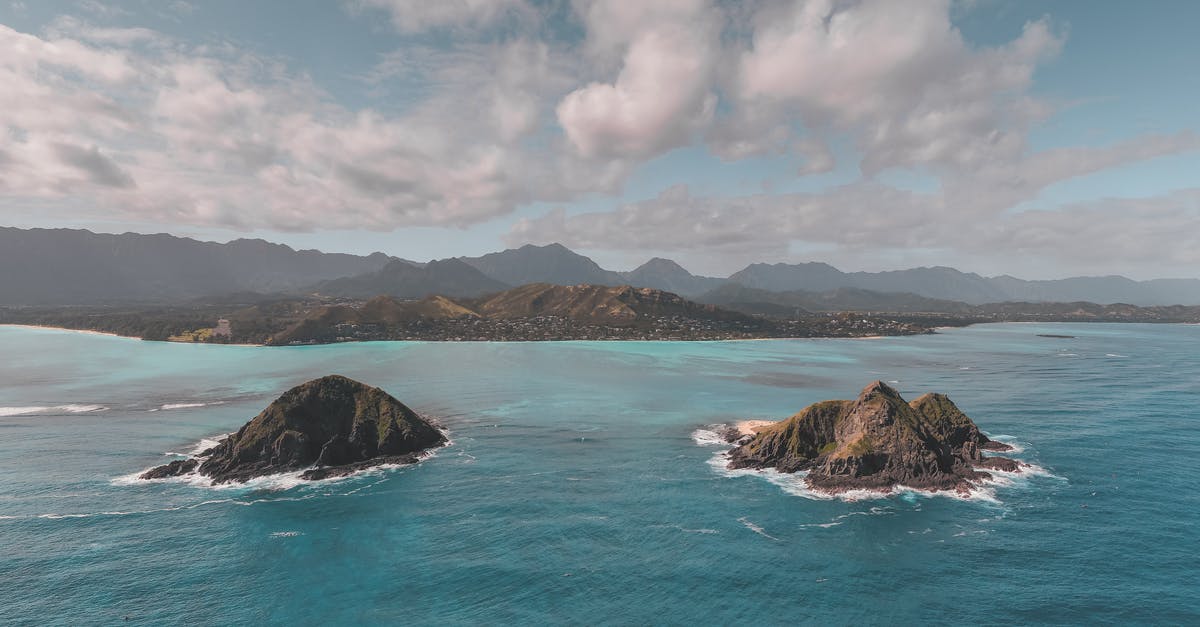 Where is this video of seaside cliffs filmed? - Brown Rock Formation on Sea Under White Clouds and Blue Sky Where is this video of seaside cliffs filmed? - Brown Rock Formation on Sea Under White Clouds and Blue Sky