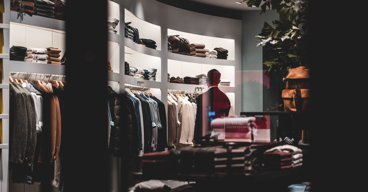 Where to buy E-ZPass at JFK? - Back view of faceless elegant male customer in suit choosing new clothes while standing near wardrobe in modern fashion boutique Where to buy E-ZPass at JFK? - Back view of faceless elegant male customer in suit choosing new clothes while standing near wardrobe in modern fashion boutique