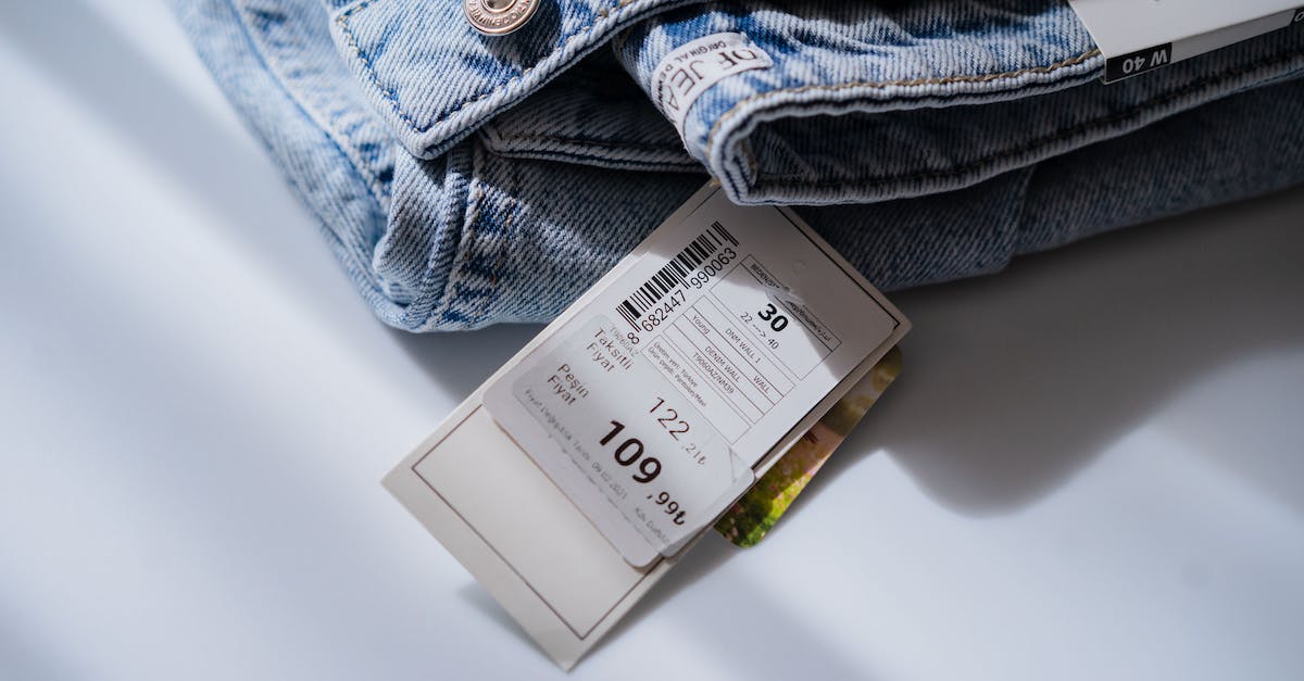 Where to buy Thai Bahts when traveling from New Zealand to Thailand? - Jeans with price ticket on white table Where to buy Thai Bahts when traveling from New Zealand to Thailand? - Jeans with price ticket on white table