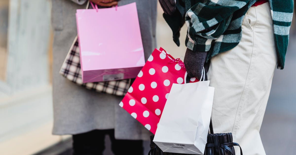 Where to buy the best tour to Neuschwanstein castle? - Crop women with purchases on street Where to buy the best tour to Neuschwanstein castle? - Crop women with purchases on street