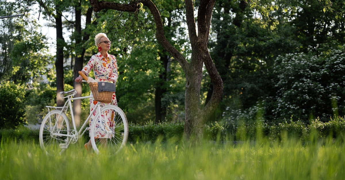 Where to find a bike to hire / buy / borrow in Southern Spain - Woman in Blue and White Floral Dress Riding on Bicycle on Green Grass Field Where to find a bike to hire / buy / borrow in Southern Spain - Woman in Blue and White Floral Dress Riding on Bicycle on Green Grass Field