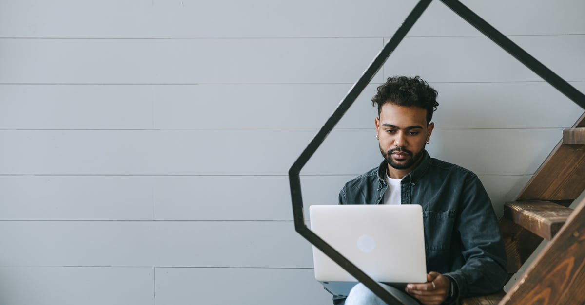 Where to get free WiFi access at JFK, landside and airside? - Man in Black Jacket Sitting on Chair Using Silver Macbook Where to get free WiFi access at JFK, landside and airside? - Man in Black Jacket Sitting on Chair Using Silver Macbook