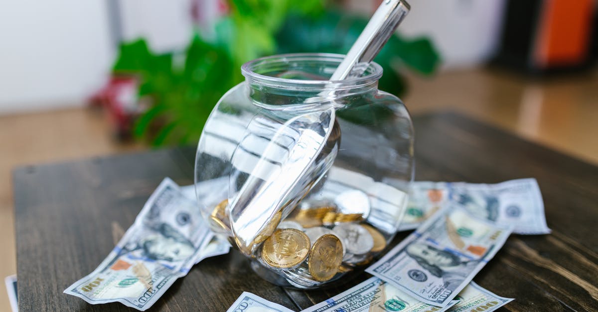 Where to offload dollars that have imperfections and slight rips in Cambodia? - Clear Glass Jar With Silver Spoon on Brown Wooden Table Where to offload dollars that have imperfections and slight rips in Cambodia? - Clear Glass Jar With Silver Spoon on Brown Wooden Table