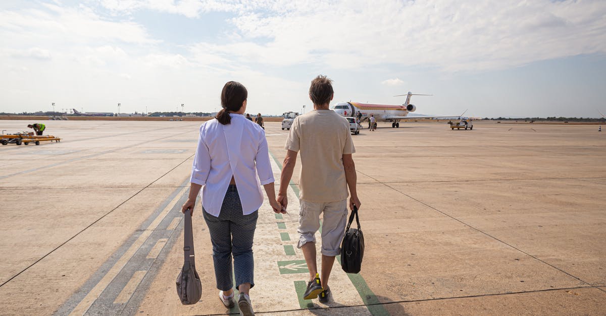 Where to pick up/drop off passengers in Toronto airport? - Couple Walking in the Airport Where to pick up/drop off passengers in Toronto airport? - Couple Walking in the Airport