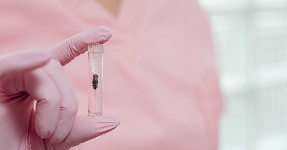 Where to print science posters in Paris? [closed] - Person Holding Clear Glass Tube