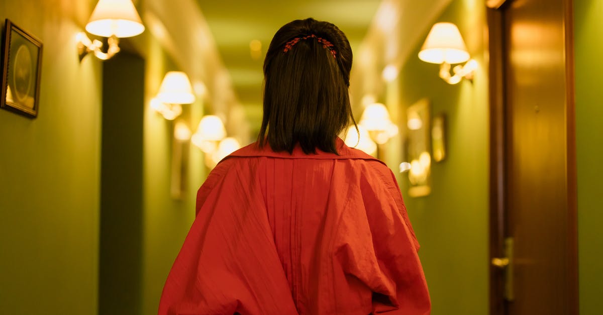 Where to stay in Isla de Coiba (Coiba Island) - Woman in Red Dress Standing in the Hallway Where to stay in Isla de Coiba (Coiba Island) - Woman in Red Dress Standing in the Hallway