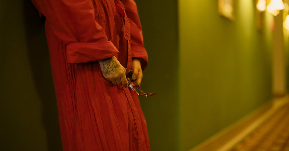 Where to stay in Isla de Coiba (Coiba Island) - Woman in Red Dress Leaning on the Wall Where to stay in Isla de Coiba (Coiba Island) - Woman in Red Dress Leaning on the Wall
