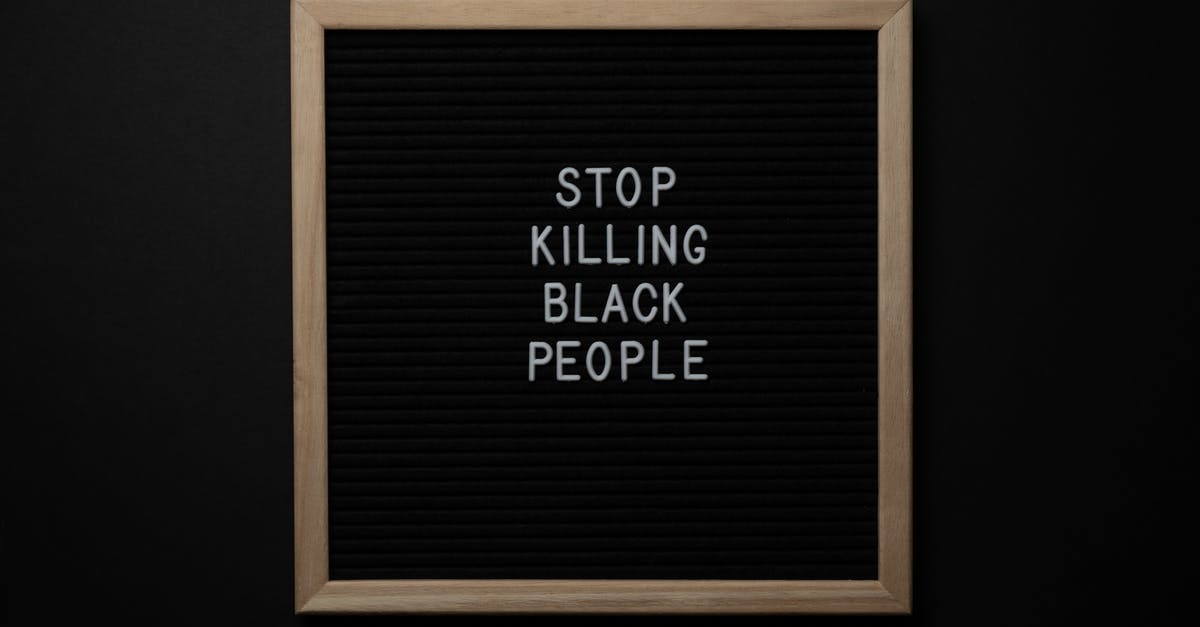 Where to stay under movement restrictions in Ireland? - Blackboard with Stop Killing Black People inscription Where to stay under movement restrictions in Ireland? - Blackboard with Stop Killing Black People inscription