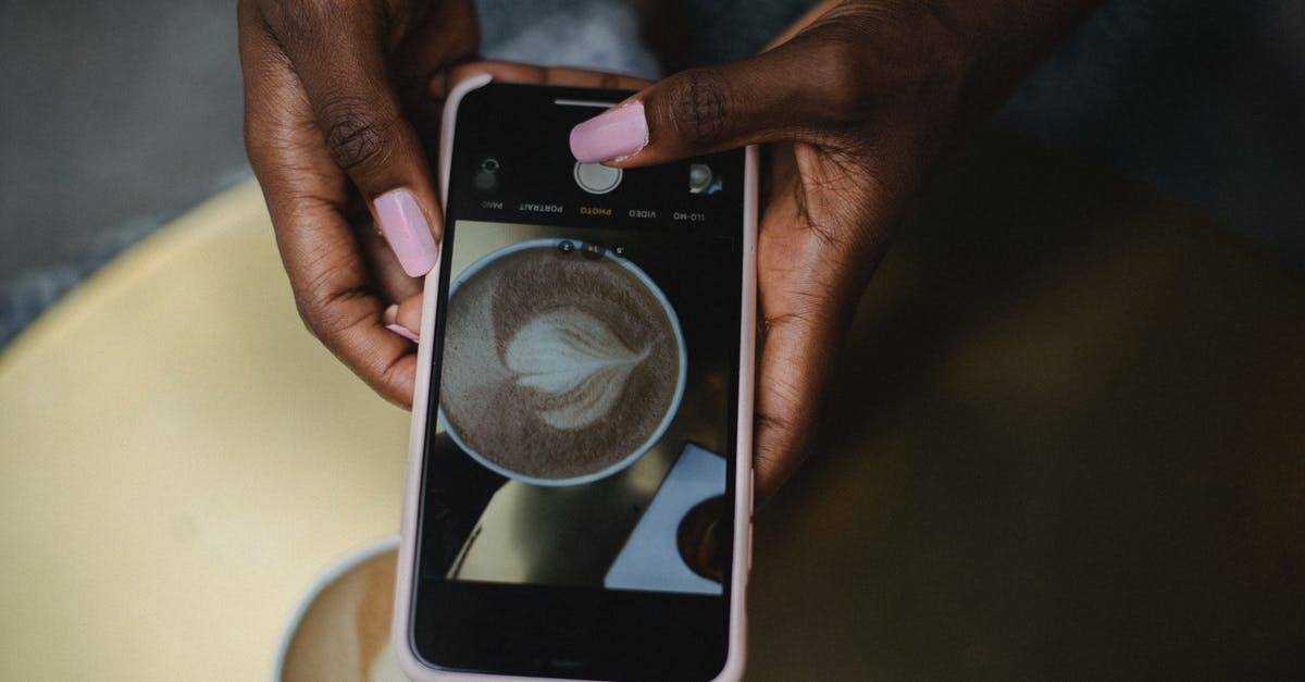 Where was this picture taken? - Person Holding Black and White Smartphone Where was this picture taken? - Person Holding Black and White Smartphone