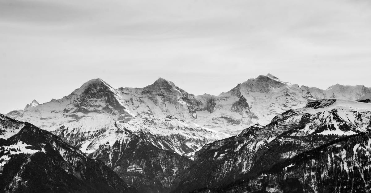 Where was this picture taken? (Chromecast background, 3 steep rocks) - Mountains With White Snow