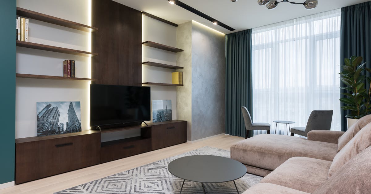 Where was this picture taken (screensaver on LG Oled TV)? - Modern TV set placed on wooden cabinet in front of soft couch in cozy living room Where was this picture taken (screensaver on LG Oled TV)? - Modern TV set placed on wooden cabinet in front of soft couch in cozy living room
