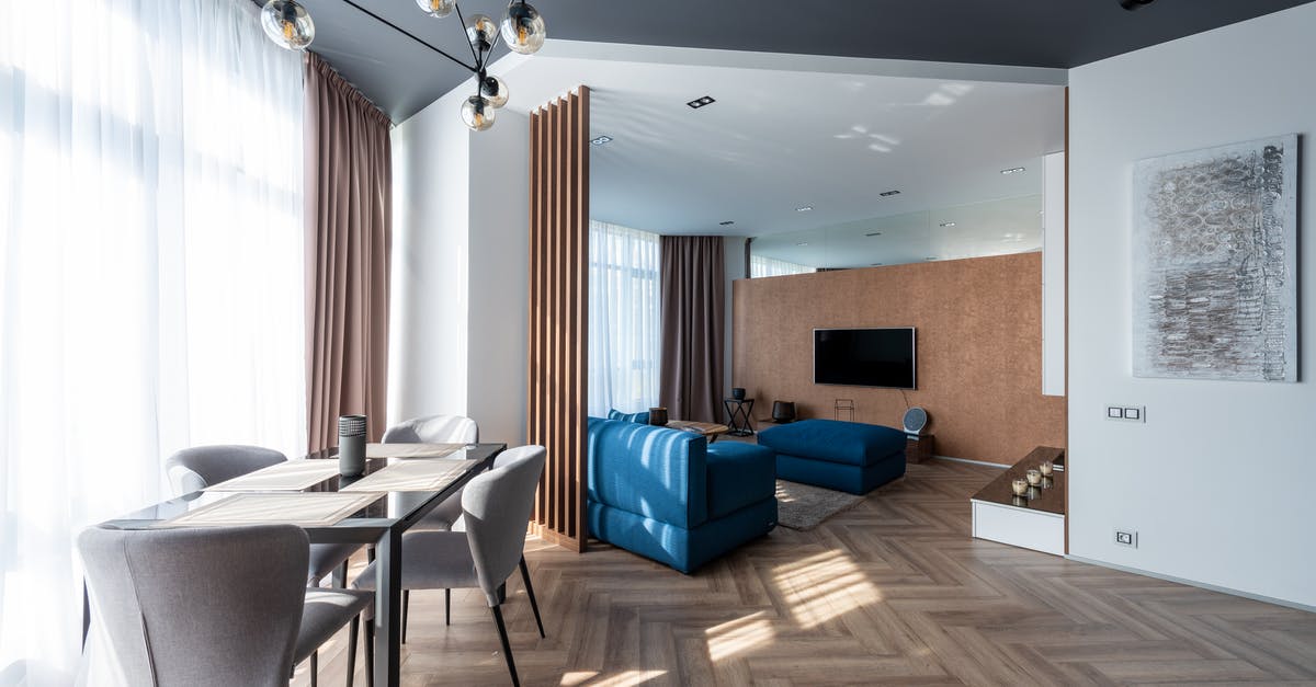 Where was this picture taken (screensaver on LG Oled TV)? - Spacious light flat with chairs and table placed near living room with comfortable sofas and TV near wall with painting Where was this picture taken (screensaver on LG Oled TV)? - Spacious light flat with chairs and table placed near living room with comfortable sofas and TV near wall with painting