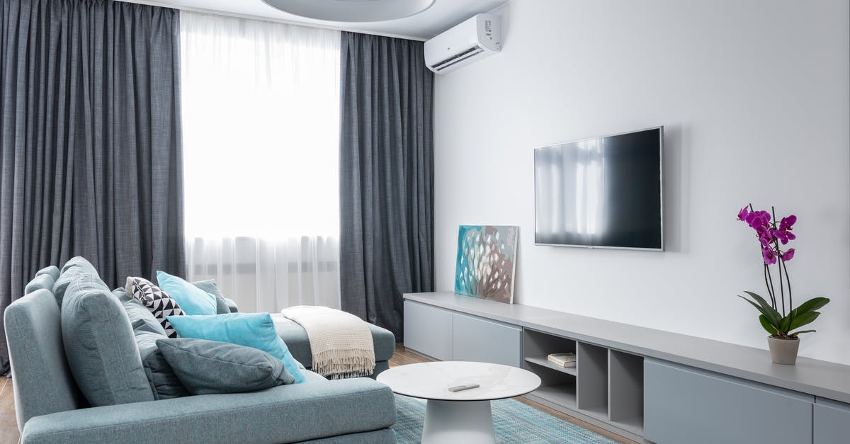 Where was this picture taken (screensaver on LG Oled TV)? - Interior of modern living room with TV on wall and blooming potted flower with picture on shelf Where was this picture taken (screensaver on LG Oled TV)? - Interior of modern living room with TV on wall and blooming potted flower with picture on shelf