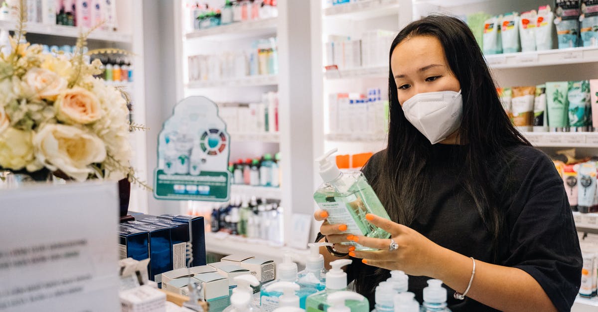 Where was this stock photo taken? - Woman in Black Shirt Holding A Hand Sanitizer Bottle Where was this stock photo taken? - Woman in Black Shirt Holding A Hand Sanitizer Bottle
