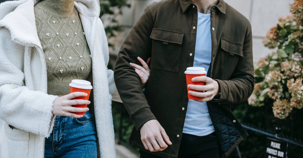 Which airlines need to hold interline agreements with each other in order for an itinerary to be bookable? - Crop anonymous young couple in stylish clothes drinking takeaway coffee and talking while walking together in city street during weekend Which airlines need to hold interline agreements with each other in order for an itinerary to be bookable? - Crop anonymous young couple in stylish clothes drinking takeaway coffee and talking while walking together in city street during weekend