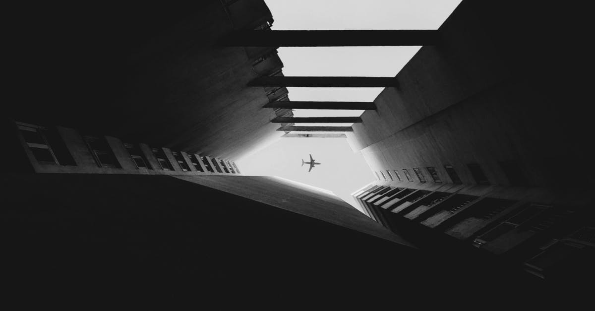 Which airplane is the safest? - Airplane Flying Between Skyscrapers in Grayscale Which airplane is the safest? - Airplane Flying Between Skyscrapers in Grayscale