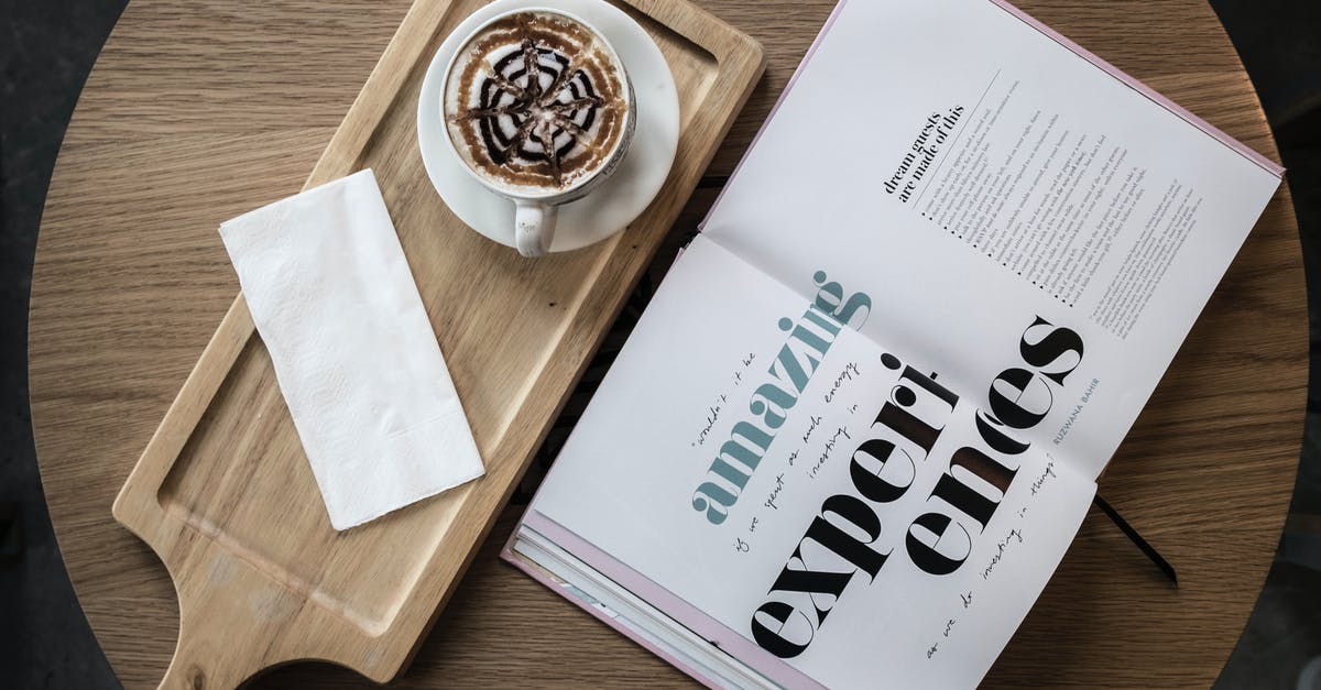 Which countries I must get a transit visa in order to board on a second flight? [closed] - Top view of cup of cappuccino garnished with chocolate topping served with saucer and napkin on wooden board placed on cafe round table with open book with amazing experiences title on pages