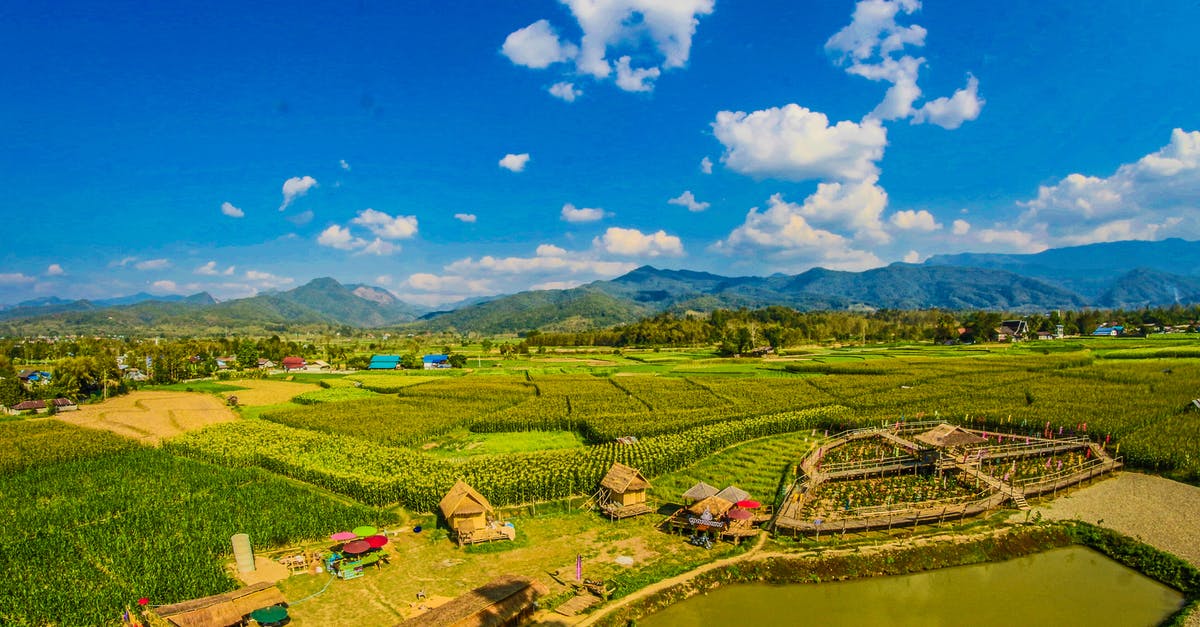 Which countries in Southeast Asia require travel insurance proof? - Rice Field With Mountain and Houses during Cloudy Day Which countries in Southeast Asia require travel insurance proof? - Rice Field With Mountain and Houses during Cloudy Day
