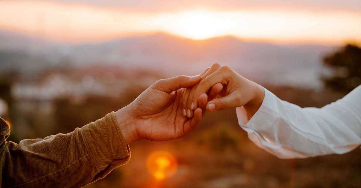 Which date is my valid departure date with a B2 visa? [closed] - Unrecognizable couple holding hands at sunset
