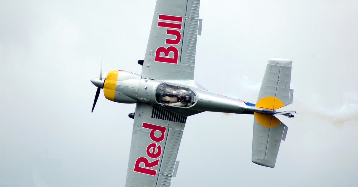 Which frequent flyer programs allow pooling of status credits? - Gray Red Bull Monoplane on Mid Air