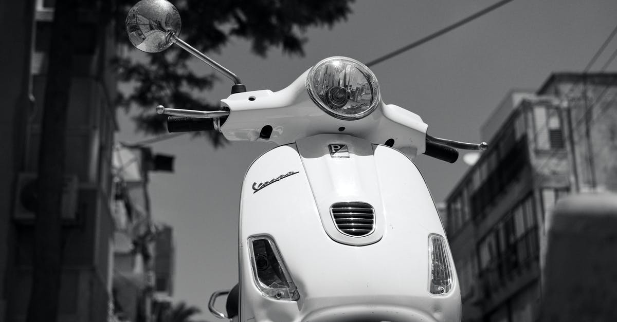 Which is faster for commuting, kick scooter or skateboard? [closed] - Grayscale Photo of a Vespa Scooter