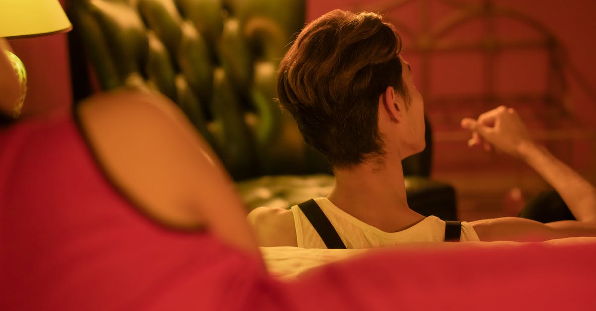 Which kind of accommodation allows guests to stay overnight? - Woman in Red Dress Lying on Bed Which kind of accommodation allows guests to stay overnight? - Woman in Red Dress Lying on Bed