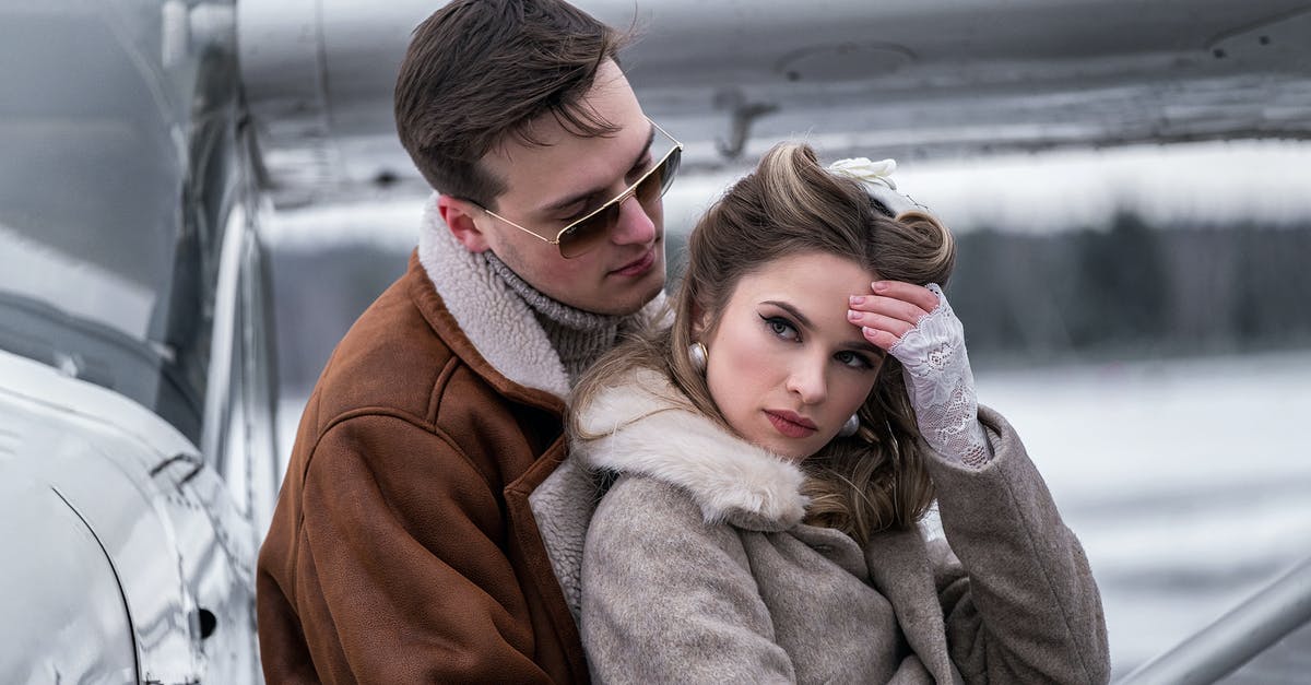 Which major airport close to Pacific Northwest has a cinema showing "Ghost In The Shell" close by? - Side view young stylish couple in outerwear cuddling gently near modern propeller jet on snowy airfield Which major airport close to Pacific Northwest has a cinema showing "Ghost In The Shell" close by? - Side view young stylish couple in outerwear cuddling gently near modern propeller jet on snowy airfield