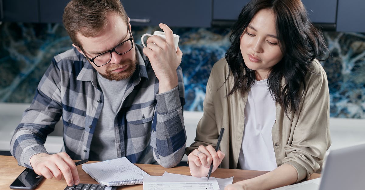 Which OTA offers PDF invoices with configurable addresses and bills for seating? - Couple Looking at their Bills Which OTA offers PDF invoices with configurable addresses and bills for seating? - Couple Looking at their Bills