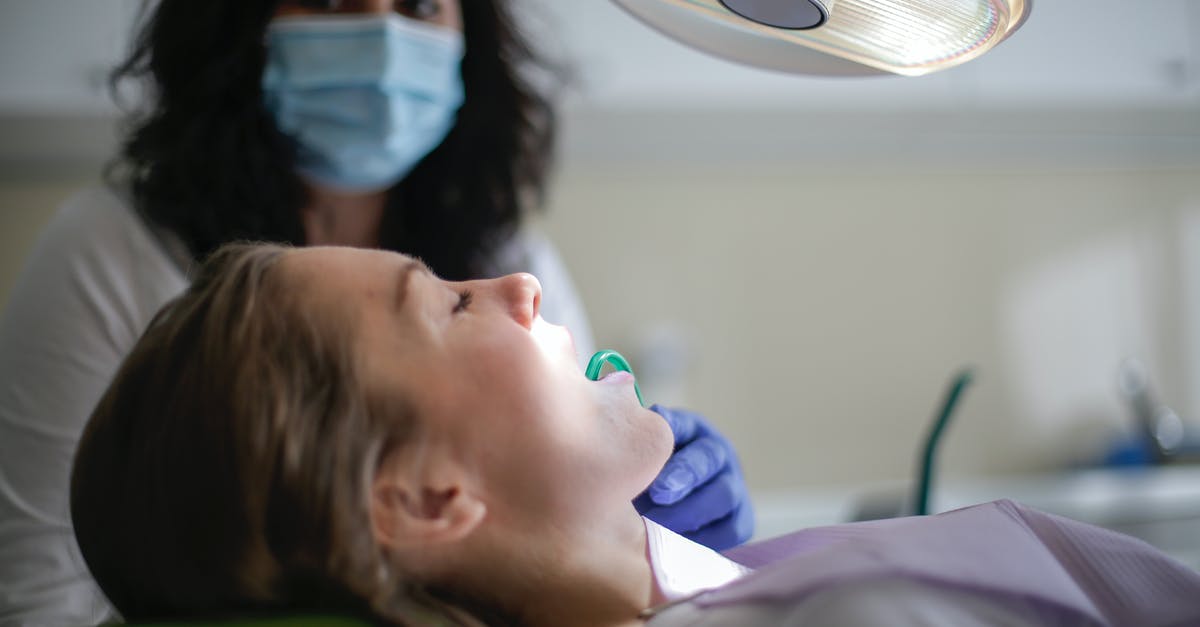 Which other Schengen countries should I visit from Munich such that the cost is minimal? [closed] - Dental assistant holding saliva ejector in mouth of patient