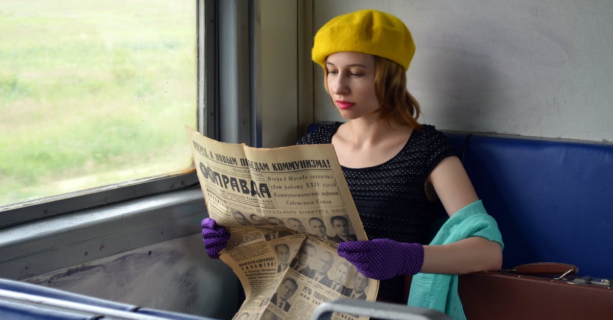 Which part of a self-propelled passenger train (DMU) is safest in an accident? - Concentrated young woman wearing elegant gloves and black blouse sitting in train with hand on suitcase and reading old Russian newspaper Which part of a self-propelled passenger train (DMU) is safest in an accident? - Concentrated young woman wearing elegant gloves and black blouse sitting in train with hand on suitcase and reading old Russian newspaper