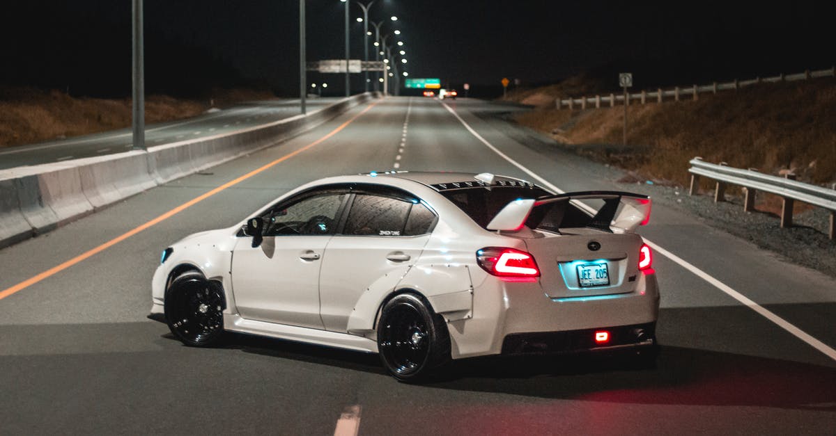 Which parts of Highway 1 are closed at the moment and how to drive around them? - Sports car turning around on road at night