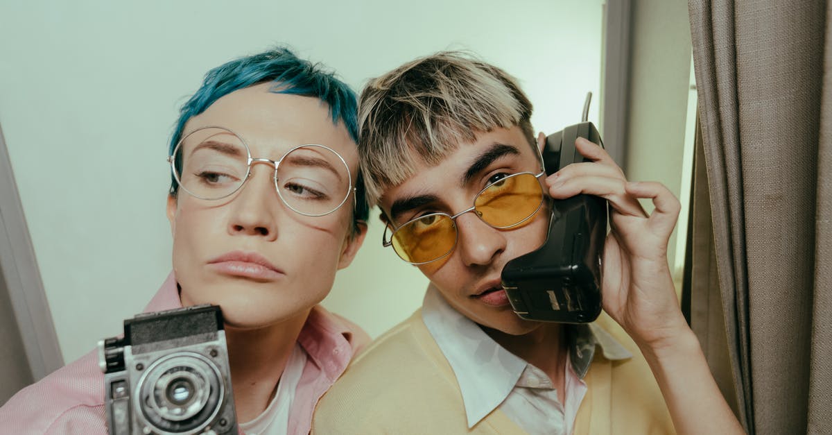Which photo type I should select in a photo booth for a Schengen Visa? - Man in Pink Button Up Shirt Holding Black Smartphone Which photo type I should select in a photo booth for a Schengen Visa? - Man in Pink Button Up Shirt Holding Black Smartphone