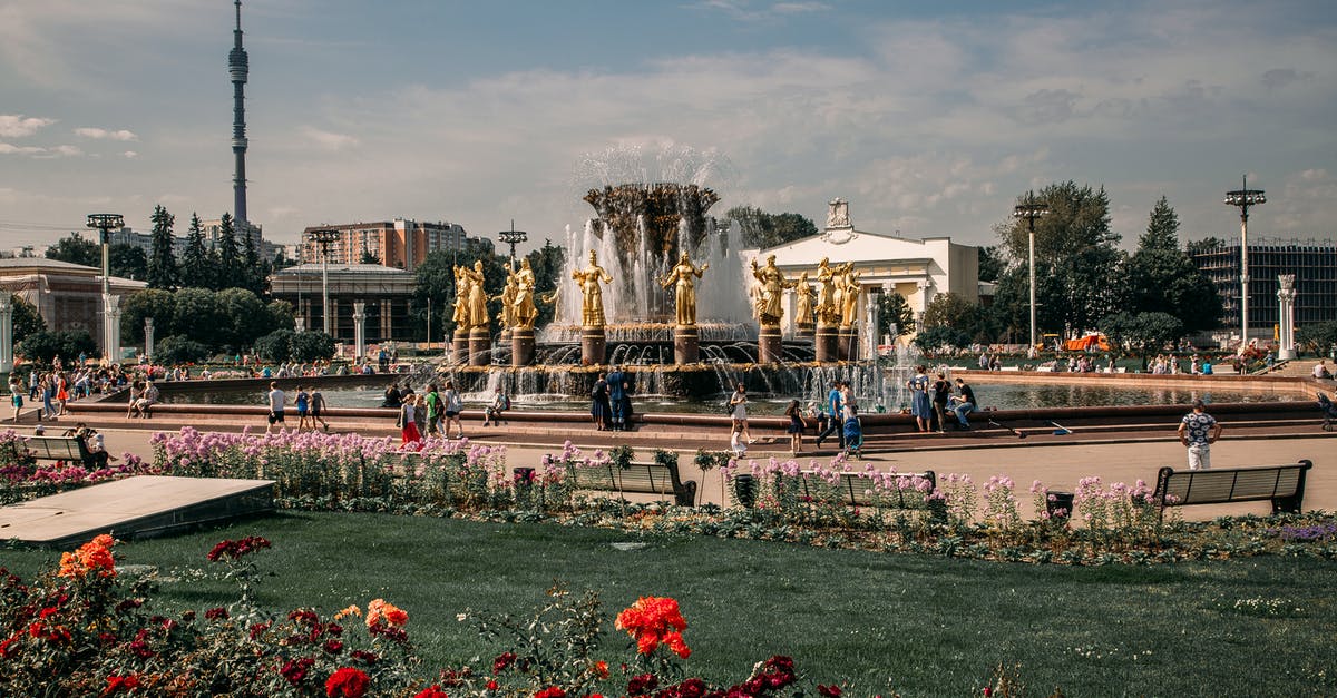 Which public parks or places accessible to tourists are on the Thousand Islands? - People Sitting Near the Fountain of a Park