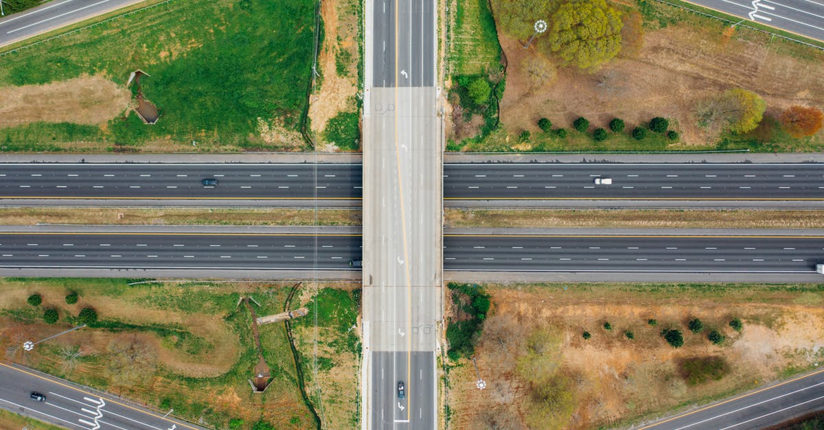 Which route to take driving from Seattle to Boston? - Road connection near green trees in suburb Which route to take driving from Seattle to Boston? - Road connection near green trees in suburb