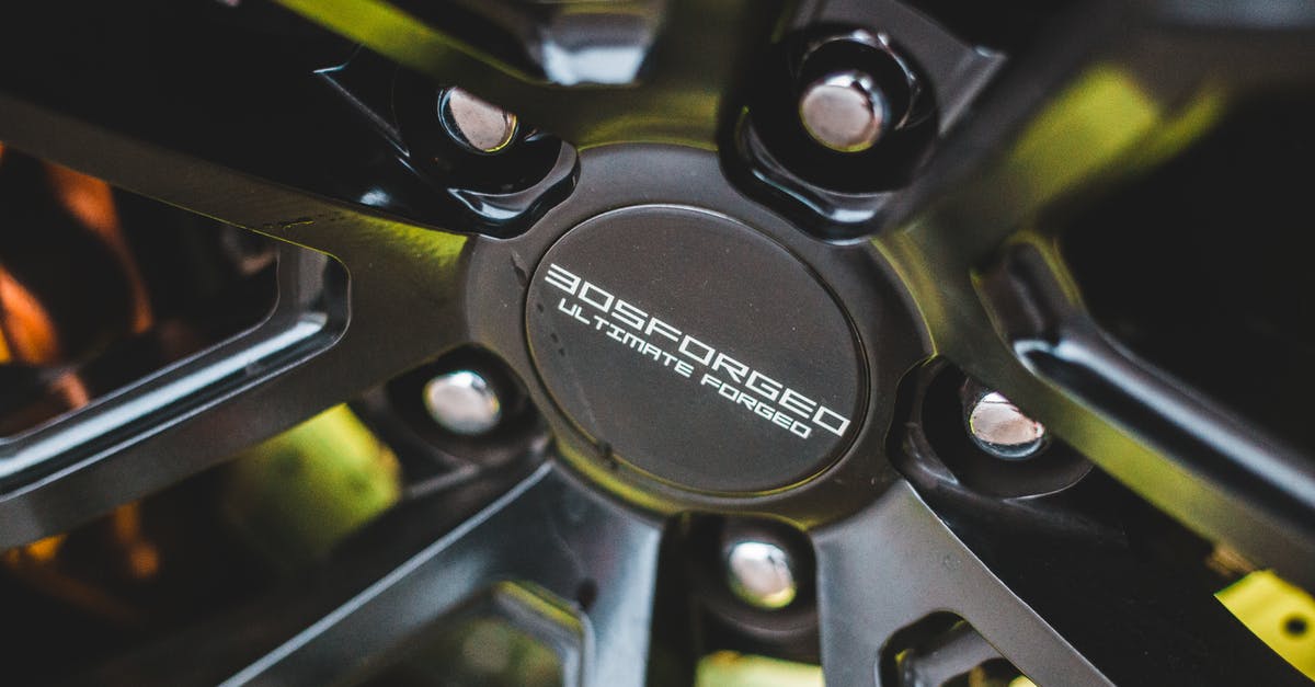 Which safety features of the German Autobahn make it possible to have no speed limits as opposed to every other country? [closed] - Closeup of new alloy wheel with silver screws in front of brake disc of sport automobile