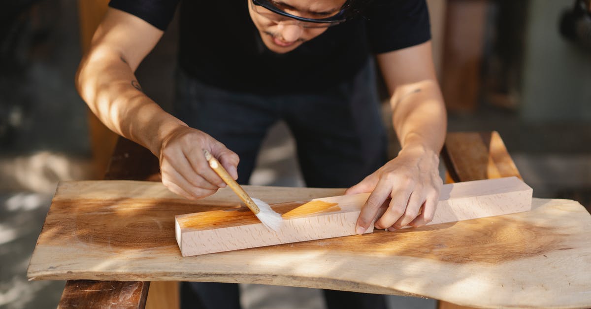 Which Schengen visa should one apply for when visiting a workshop? - Young ethnic carpenter applying protective varnish on wooden detail while working in professional workshop Which Schengen visa should one apply for when visiting a workshop? - Young ethnic carpenter applying protective varnish on wooden detail while working in professional workshop